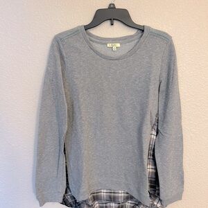 Women’s long sleeve gray top size small. Part of the shirt is plaid in the back.